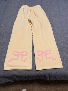 Edikted yellow sweatpants with Pink Bow detail